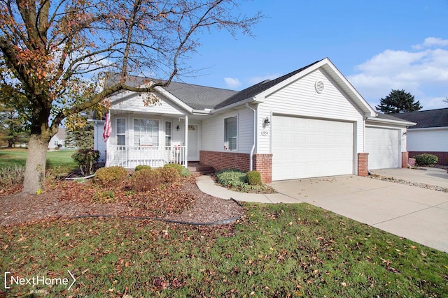 single story home featuring a porch and a garage