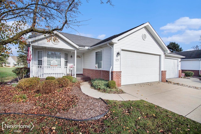 ranch-style house with a garage and covered porch