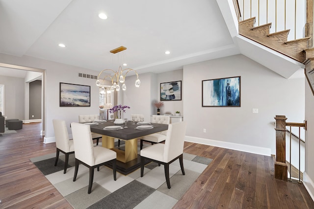 dining room featuring wood-type flooring and a notable chandelier