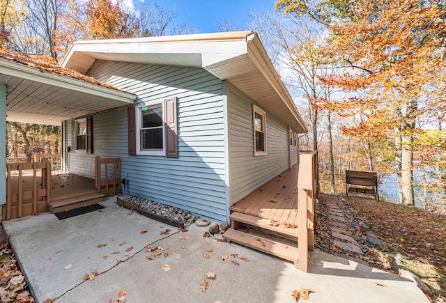 view of property exterior with a deck