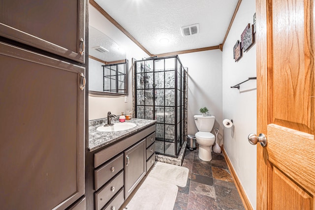 bathroom featuring ornamental molding, vanity, a textured ceiling, a shower, and toilet