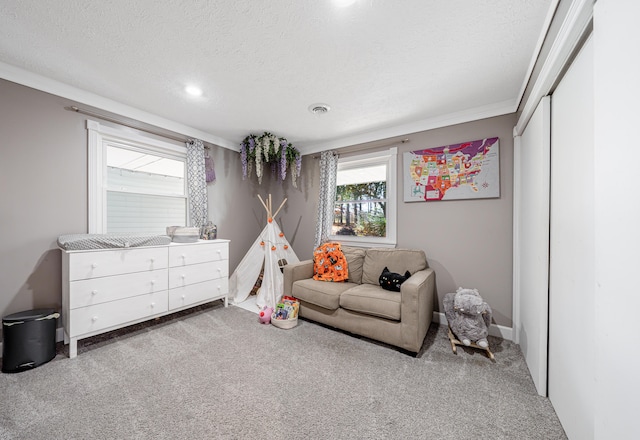 carpeted bedroom featuring a closet, a textured ceiling, and ornamental molding