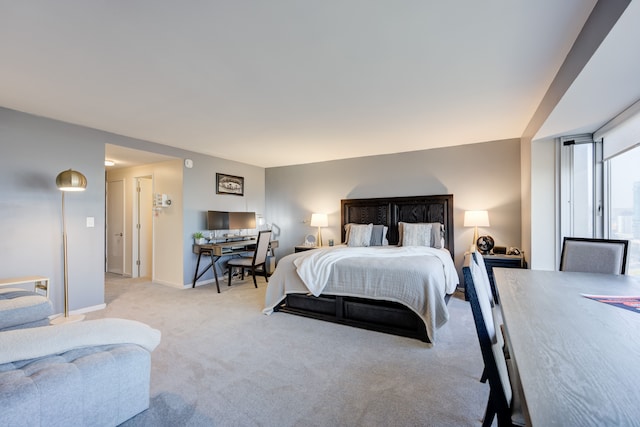 bedroom featuring light carpet