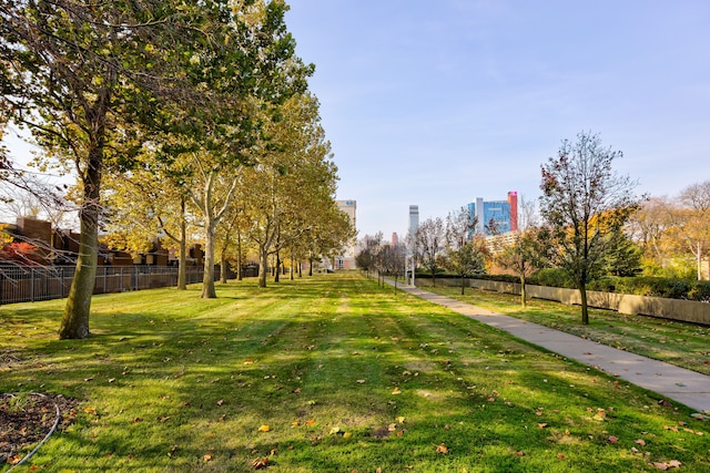 view of property's community with a lawn