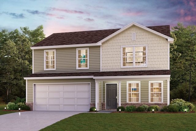 view of front of property with a garage and a lawn