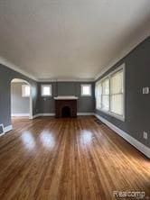 unfurnished living room featuring hardwood / wood-style flooring