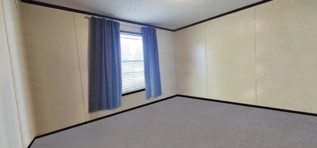 empty room featuring a textured ceiling