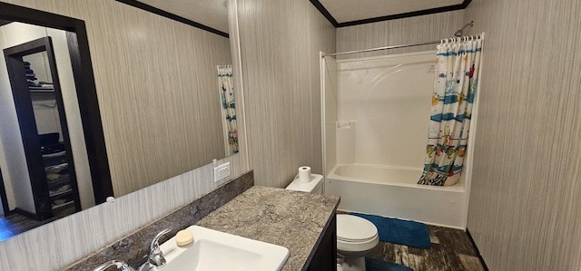 full bathroom featuring crown molding, shower / tub combo with curtain, vanity, and wood-type flooring