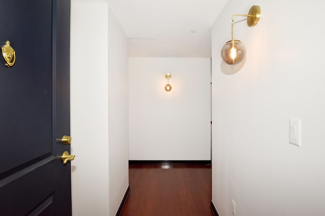 corridor with dark wood-type flooring