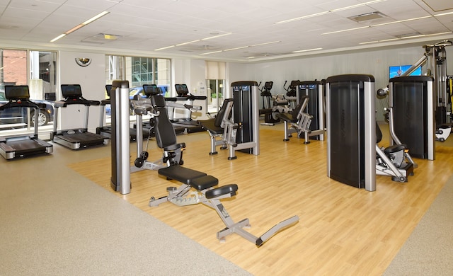 gym with wood-type flooring