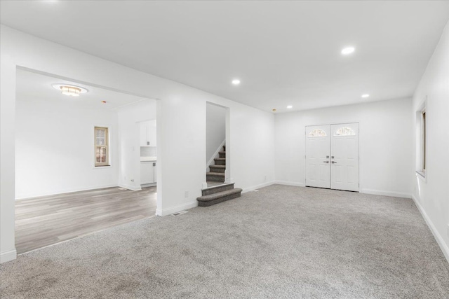 unfurnished living room with light wood-type flooring