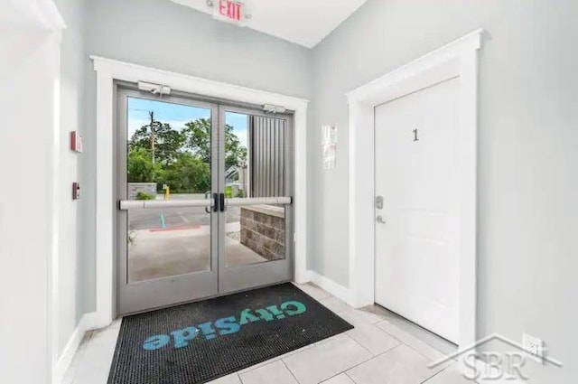 entryway with light tile patterned floors