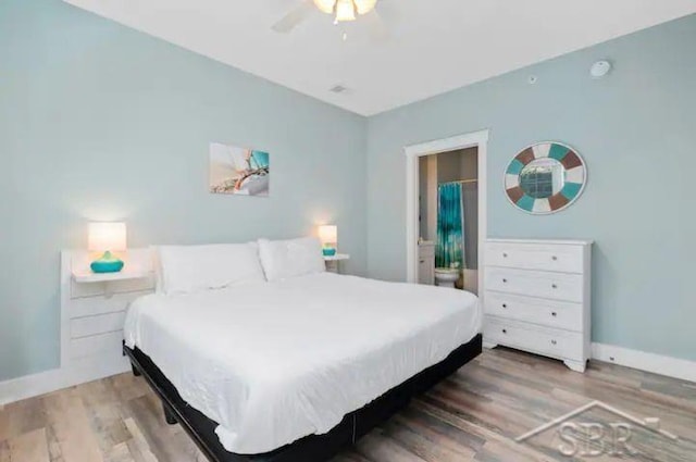 bedroom with hardwood / wood-style floors and ceiling fan