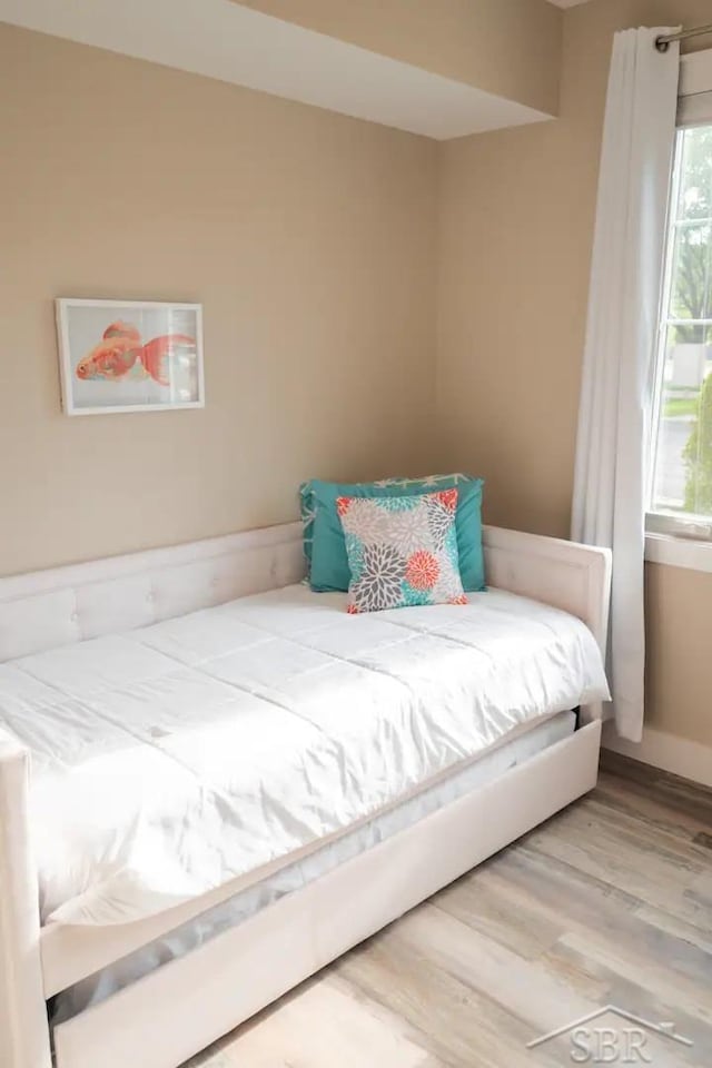 bedroom with hardwood / wood-style floors