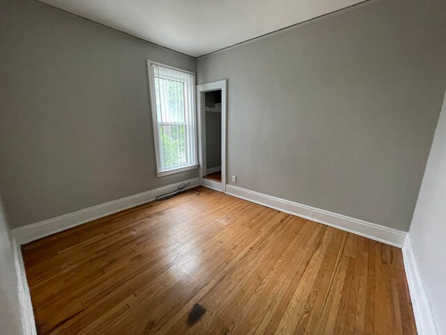 spare room featuring hardwood / wood-style flooring