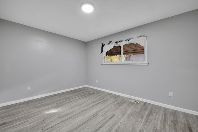 unfurnished room featuring light hardwood / wood-style floors