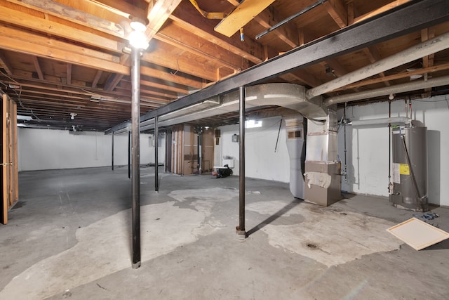 basement featuring heating unit and water heater