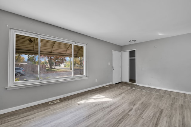 empty room with light wood-type flooring