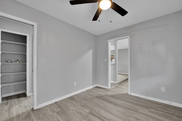 unfurnished bedroom with light wood-type flooring and ceiling fan