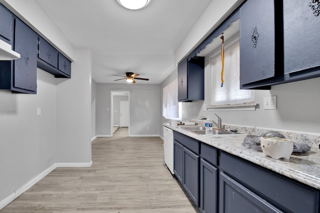 kitchen featuring ceiling fan, sink, dishwasher, light hardwood / wood-style flooring, and blue cabinets