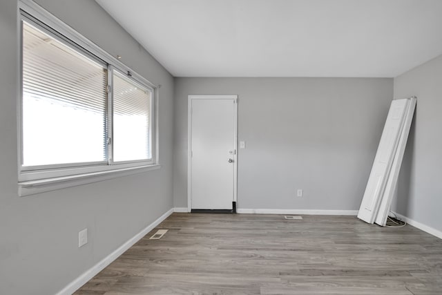 unfurnished room featuring light hardwood / wood-style flooring