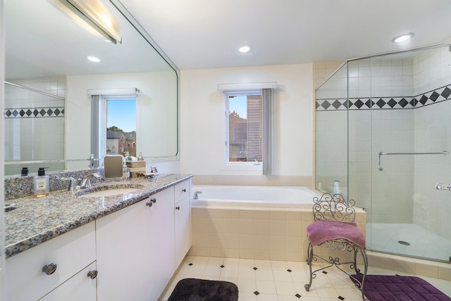 bathroom with vanity, tile patterned floors, and independent shower and bath