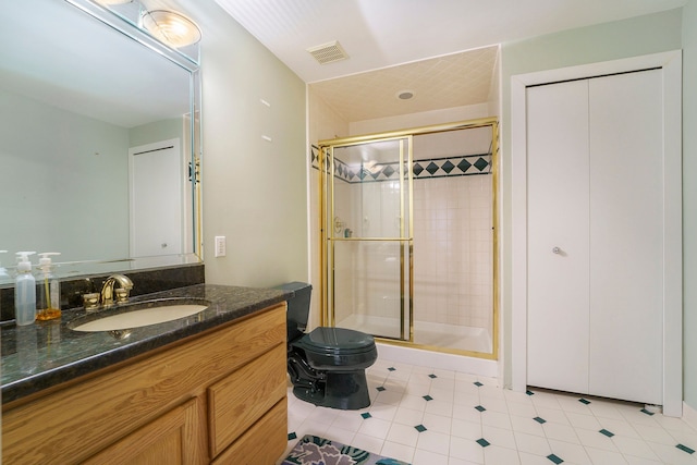 bathroom with vanity, toilet, and walk in shower