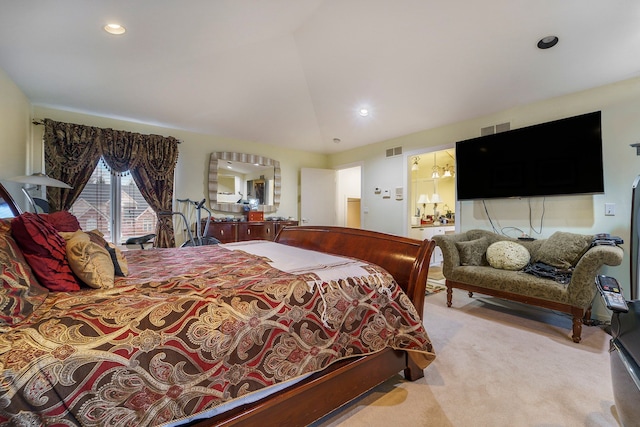 carpeted bedroom featuring vaulted ceiling