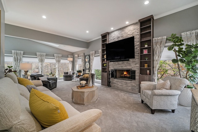 carpeted living room featuring a fireplace, vaulted ceiling, and ornamental molding