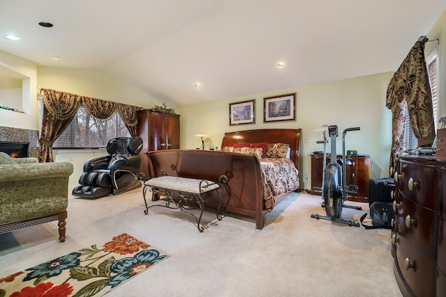 carpeted bedroom with vaulted ceiling