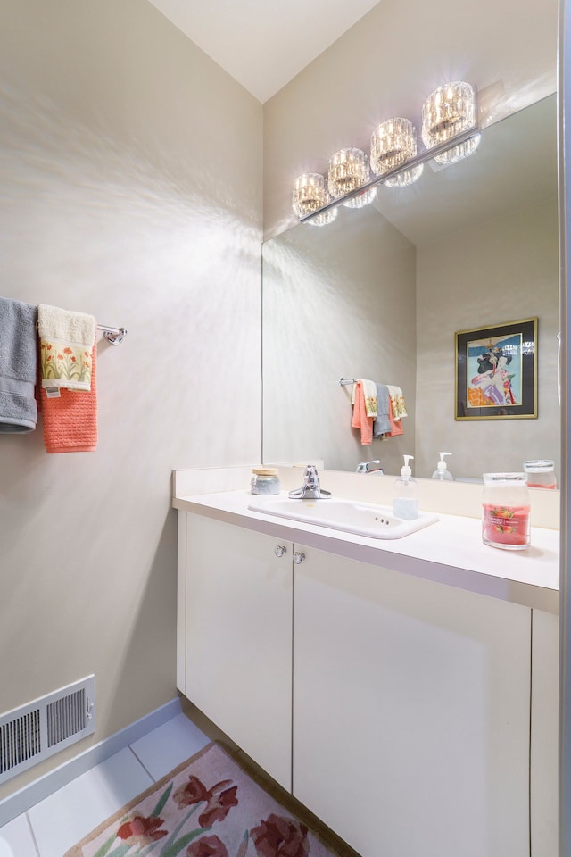 bathroom with tile patterned flooring and vanity