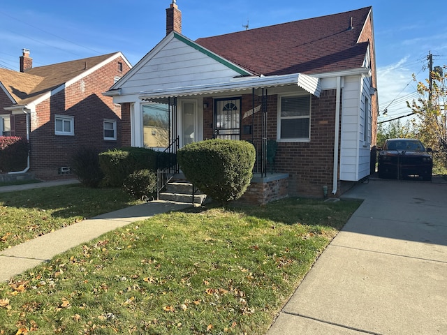 bungalow with a front yard