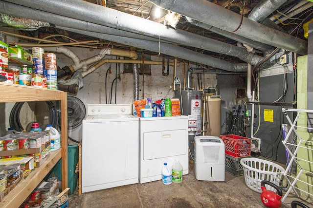 basement featuring heating unit, independent washer and dryer, and water heater