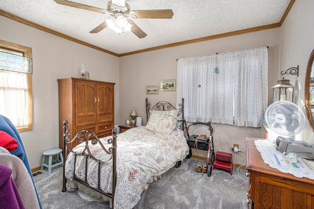 carpeted bedroom featuring ceiling fan, ornamental molding, and a textured ceiling