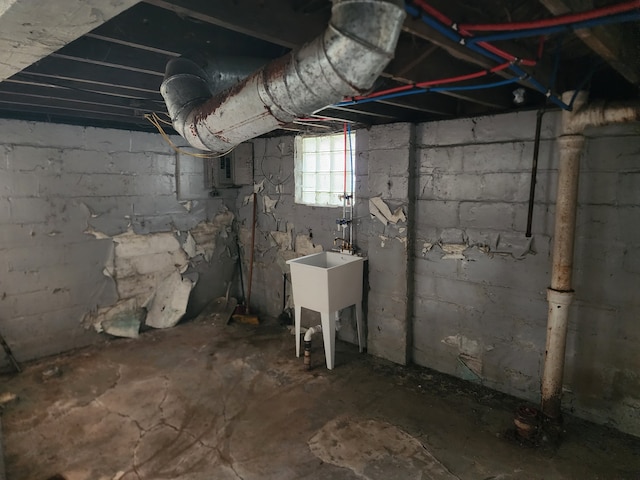 basement with electric panel and sink