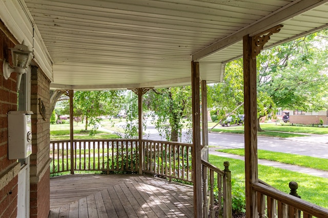 wooden terrace with a porch