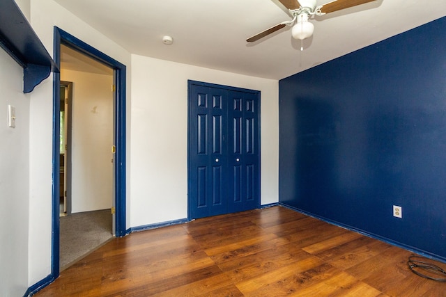 interior space with ceiling fan and dark hardwood / wood-style flooring