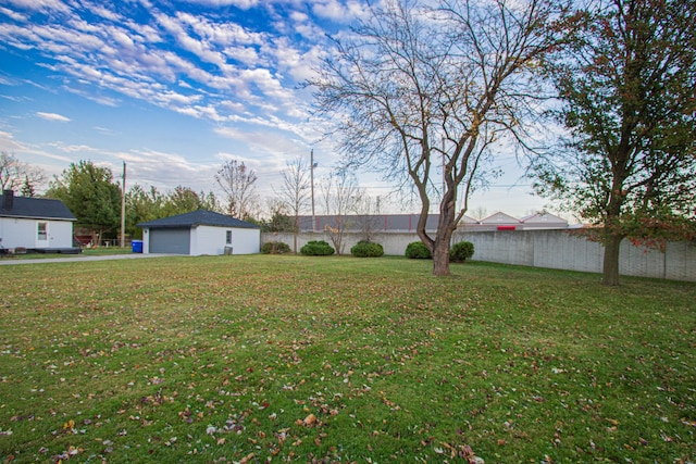 view of yard featuring an outbuilding and a garage