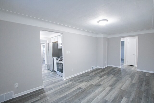 empty room with wood-type flooring