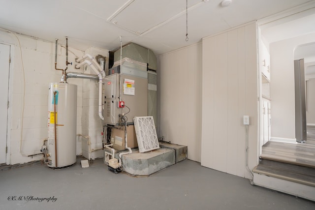 utility room featuring water heater