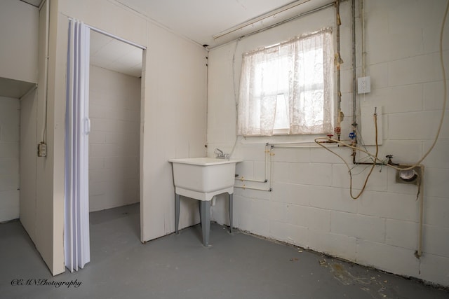 interior space featuring concrete block wall