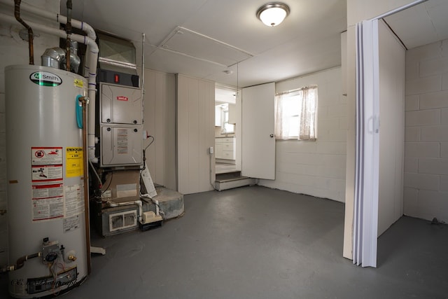 utility room featuring gas water heater