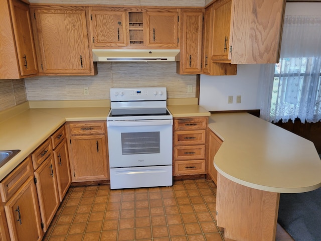 kitchen featuring white range with electric stovetop, decorative backsplash, kitchen peninsula, and light tile patterned floors