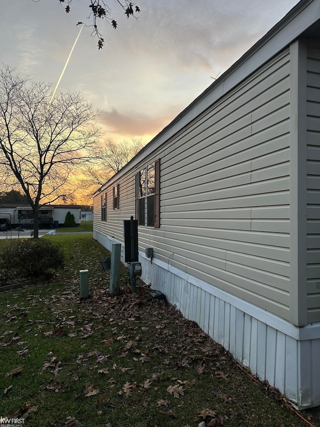 view of property exterior at dusk