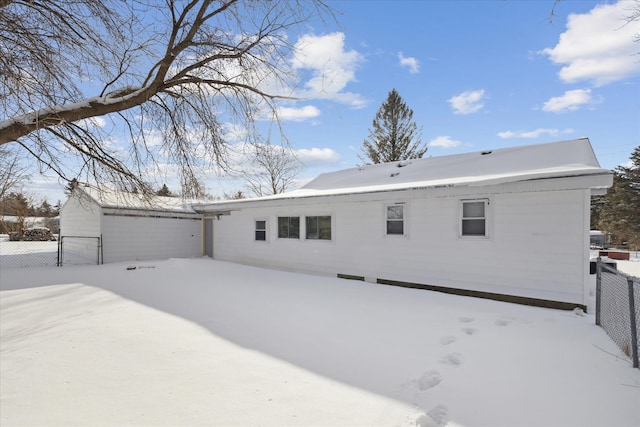 view of front of home featuring fence