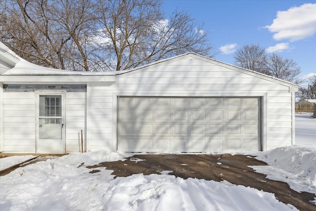 view of snow covered garage