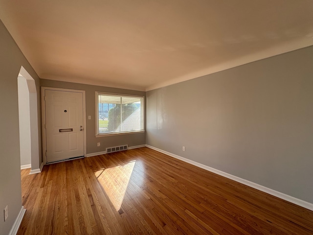 spare room featuring hardwood / wood-style floors