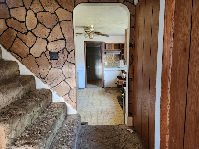 315 Mcomber St, Dowagiac, MI 49047 - corridor featuring tile patterned floors and stairs