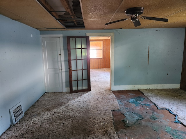 unfurnished room with ceiling fan