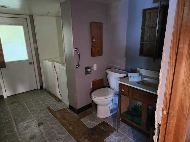 bathroom featuring hardwood / wood-style floors, vanity, and toilet